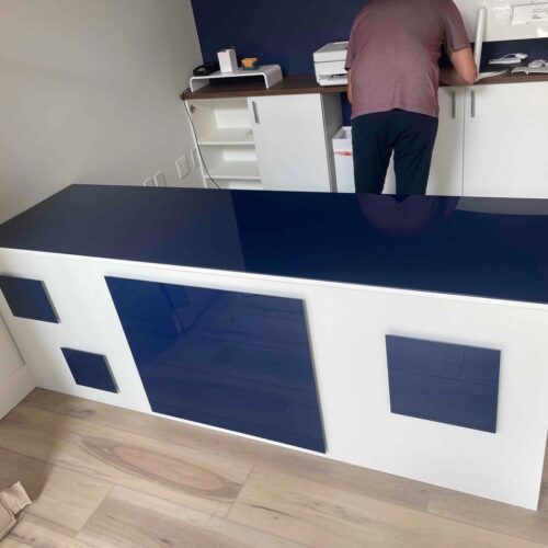 Geometric Blue Reception Desk with Custom Design