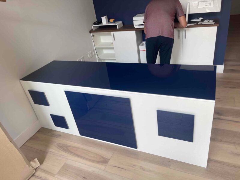 Geometric Blue Reception Desk with Custom Design