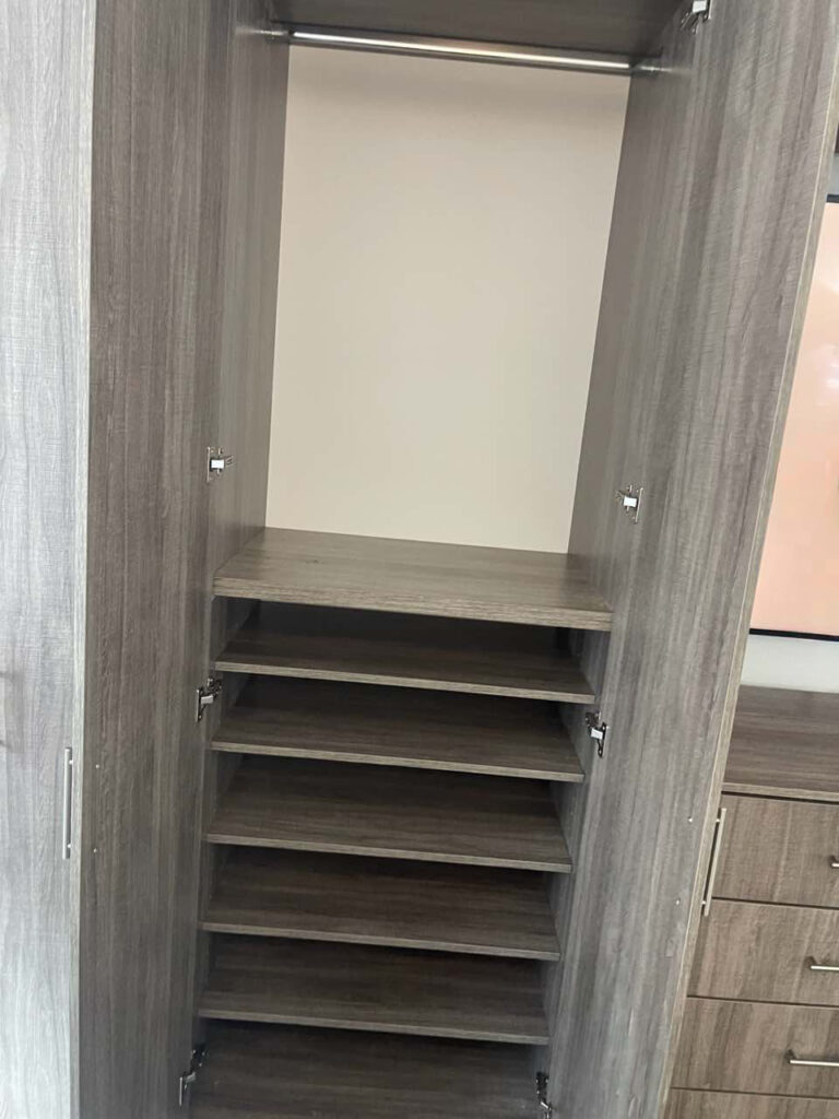 Custom Bedroom Entertainment Center with Integrated Wardrobes for Manhattan Apartment