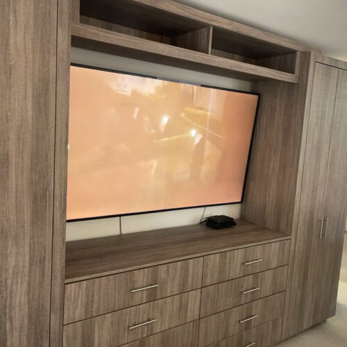 Custom Bedroom Entertainment Center with Integrated Wardrobes for Manhattan Apartment