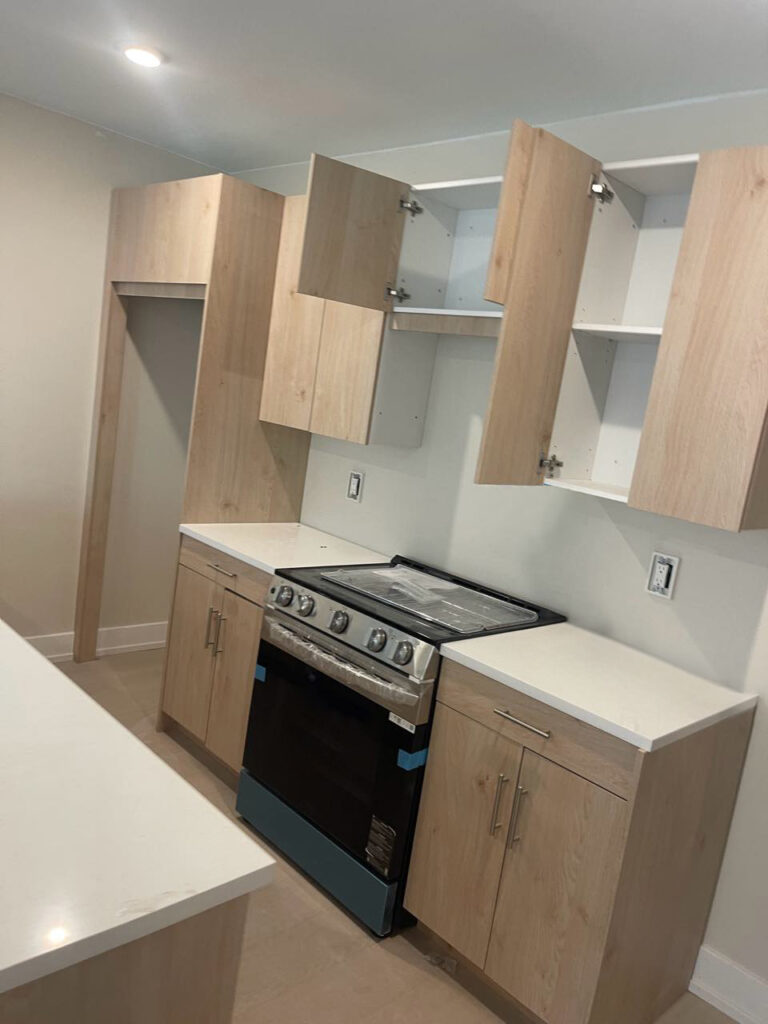 Custom Multi-Unit Kitchen Cabinets: Light Wood Grain with Bronze Accents