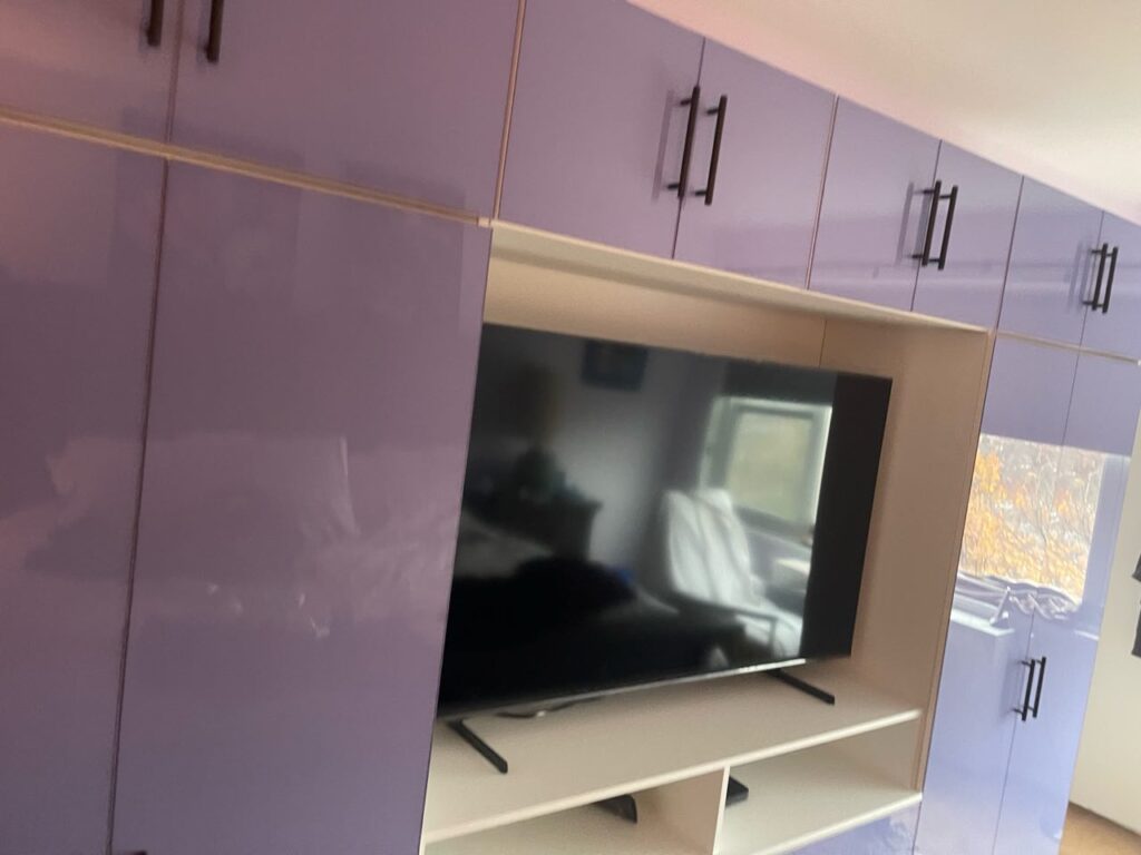 Custom French Lilac Colored Glass TV Armoire in Bronxville, NY